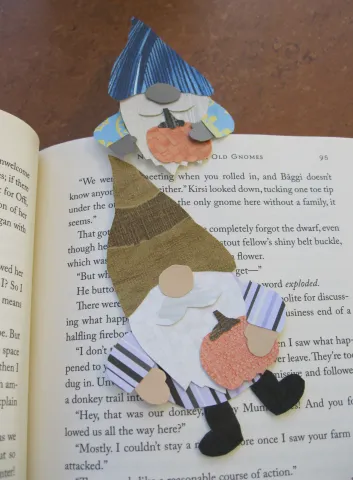 two gnome bookmarks on a library book