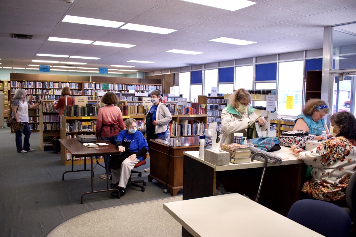 A picture of customers at a book sale.